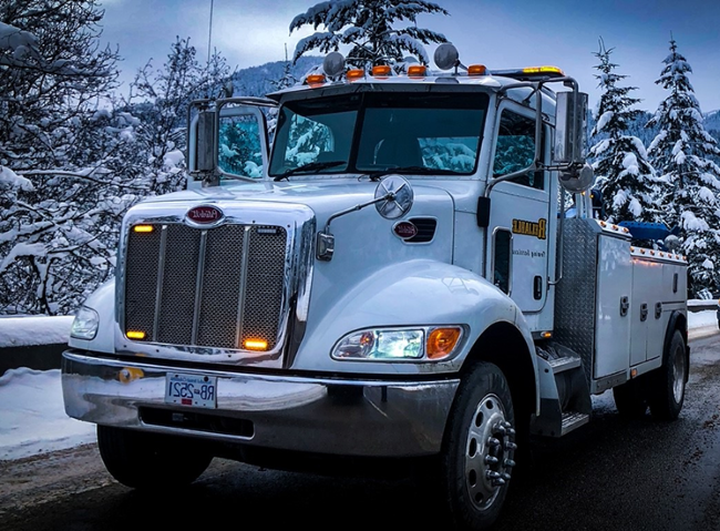 White Reliable heavy towing truck in the snow image